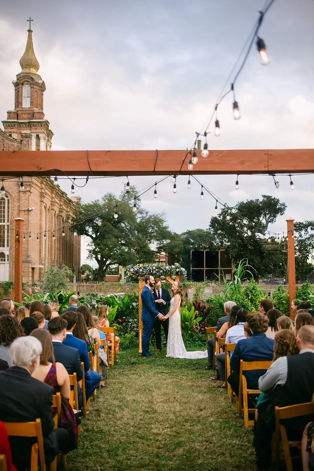 Outdoor wedding reception New Orleans at Paradigm Gardens. Best wedding photographer for candid wedding photos in New Orleans Eyoel Kahssay.